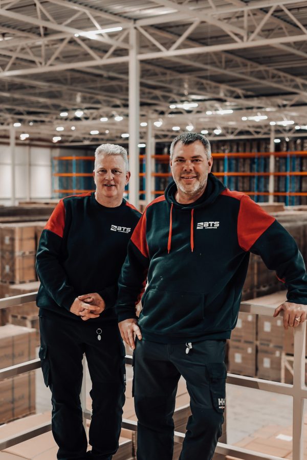 Employees: Jeffrey and Tom picture taken in warehouse